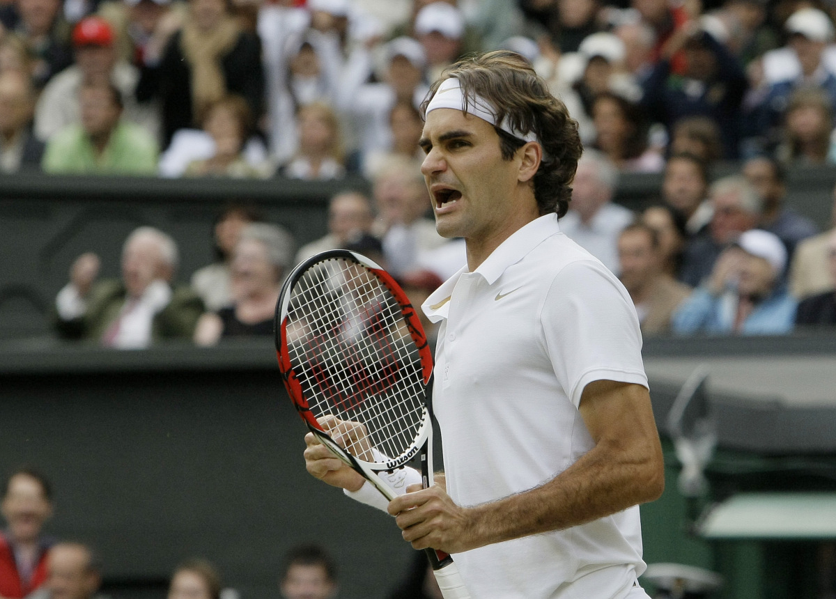 Switzerland's Roger Federer reacts after winning the third sets against Spain's Rafael Nadal during the men's final on the Centre Court at Wimbledon, Sunday July 6 , 2008. (AP Photo/Anja Niedringhaus) ORG XMIT: XWIM189