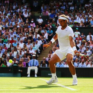 LONDON, ENGLAND - JUNE 24: Rafael Nadal of Spain plays a forehand during his Gentlemen's Singles first round match against Martin Klizan of Slovakia on day two of the Wimbledon Lawn Tennis Championships at the All England Lawn Tennis and Croquet Club at Wimbledon on June 24, 2014 in London, England. (Photo by Al Bello/Getty Images)