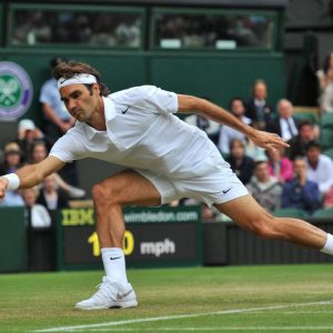 Switzerland's Roger Federer returns against Luxembourg's Gilles Muller during their men's singles second round match on day four of the 2014 Wimbledon Championships at The All England Tennis Club in Wimbledon, southwest London, on June 26, 2014. AFP PHOTO / GLYN KIRK - RESTRICTED TO EDITORIAL USEGLYN KIRK/AFP/Getty Images