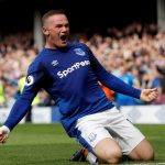 Wayne Rooney scores from inside his own half