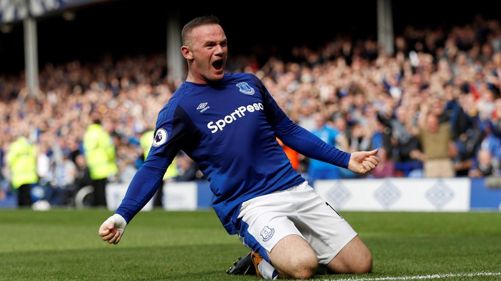 Wayne Rooney scores from inside his own half