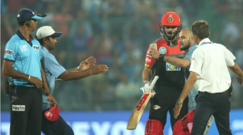 Fan runs on to the field, clicks selfie with Kohli