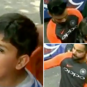 Kohli poses with fan for a picture