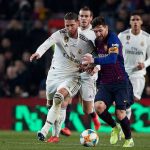 Sergio Ramos and Lionel Messi battle out for the ball