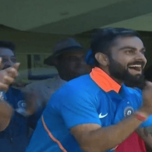 Virat Kohli celebrates as Jasprit Bumrah hits a six
