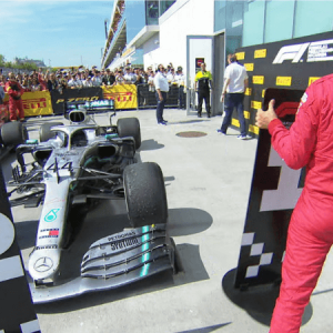 Sebastian Vettel puts the number 2 board in front of Lewis Hamilton's car after Canadian GP controversy