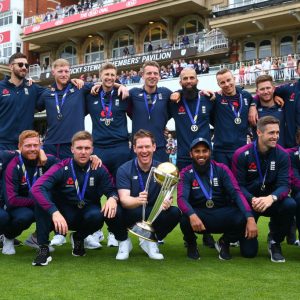 Triple H presents the English Cricket Team with a custom WWE championship belt following their maiden World Cup triumph