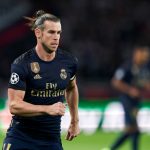 Gareth Bale hesitated holding Real Madrid’s flag during a team photo before the game vs PSG