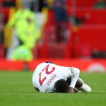 Divock Origi goes down while holding the wrong leg after foul from Victor Lindelof