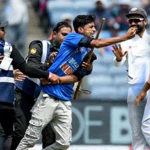 Rohit Sharma falls down after fan tries to touch his feet after invading into pitch