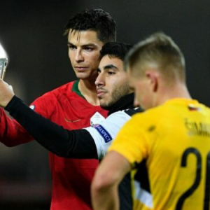 Cristiano Ronaldo stops match to take selfie with pitch invader during Portugal vs Lithuania