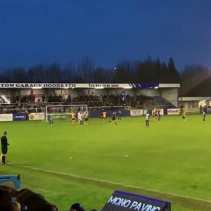 Watch Nuneaton Borough keeper misses penalty and hilariously breaks a light off the roof of the stand