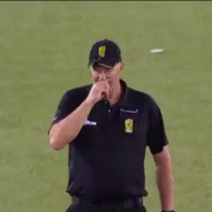 BBL 2019 umpire Greg Davidson fakes a nose itch off Rashid Khan’s bowling during Renegades vs Strikers