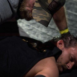 Pat McAfee assaults Adam Cole and gets kicked out of the Arena