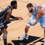 'That was a dangerous play': Jonas Valanciunas pulls down Chimezie Metu's leg after getting dunked on during Grizzlies' game against the Kings