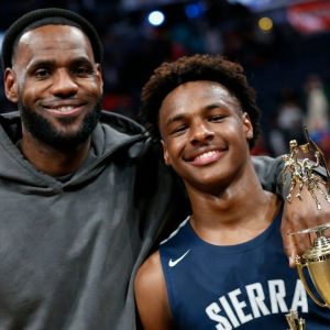 "Bronny James gets mocked for complaining to the referees": The crowd bullies the 17-year old by raising the China flag with LeBron James' crying face on it