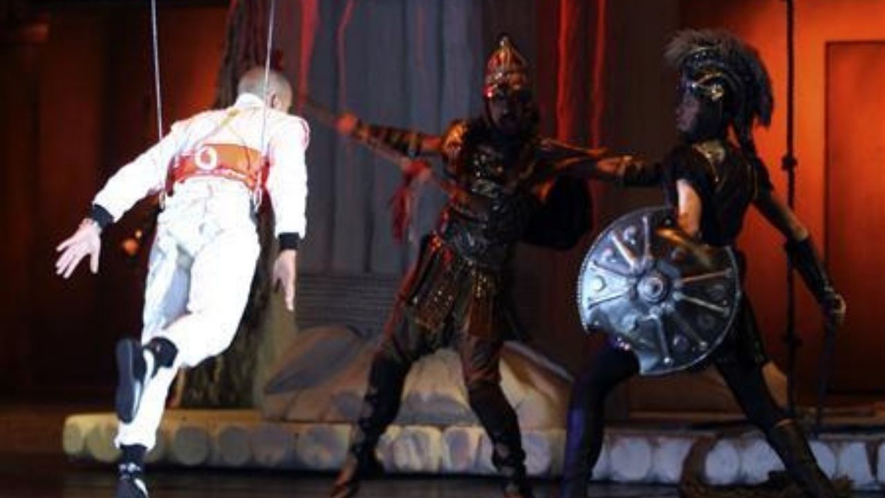 "Ron Dennis should go to jail for making Hamilton do this"– Watch Lewis Hamilton fly into theatre stage in McLaren F1 suit and does sword battle