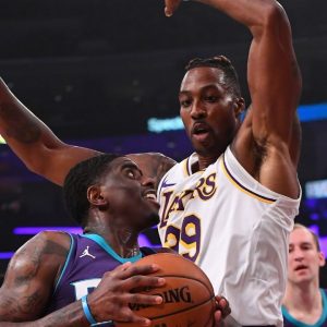 Dwight Howard is a ferocious rebounder and rim protector. So what happens when he gets into foul trouble? He kisses the referee, of course!