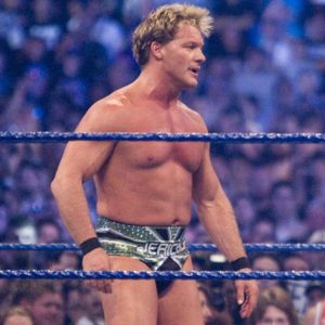 Chris Jericho reacts to Neville's injury during their match