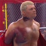 Cody Rhodes wrestling with a torn pectoral muscle at Hell in a Cell