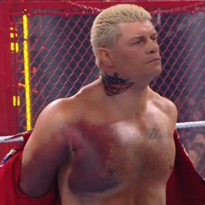 Cody Rhodes wrestling with a torn pectoral muscle at Hell in a Cell