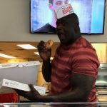 7ft, 325 pound Shaquille O’Neal really gobbled down a doughnut without even biting into it