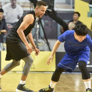 Stephen Curry tosses a Korean fan's LeBron James shoes to the sidelines before gifting him the SC30s and autographing them.