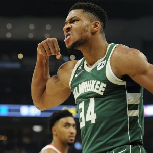 Oct 22, 2022; Milwaukee, Wisconsin, USA; Milwaukee Bucks forward Giannis Antetokounmpo (34) mean mugs to the audience after powering his way to the basket and being fouled by a Houston Rockets player in the first quarter at Fiserv Forum. Mandatory Credit: Michael McLoone-USA TODAY Sports
