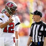 Tampa Bay Buccaneers quarterback Tom Brady (12) discusses a call with side judge Jonah Monroe (120) during the second half against the Atlanta Falcons at Raymond James Stadium