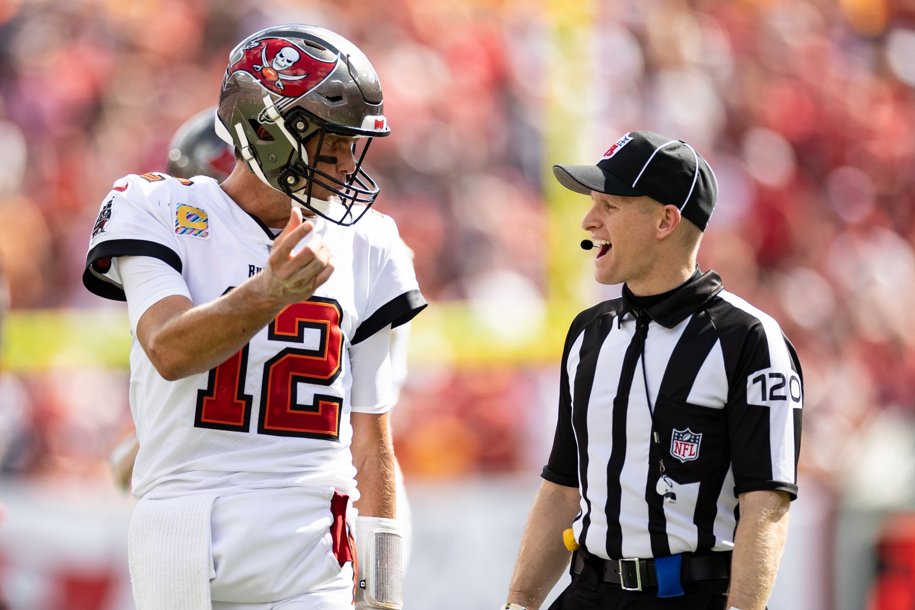 Tampa Bay Buccaneers quarterback Tom Brady (12) discusses a call with side judge Jonah Monroe (120) during the second half against the Atlanta Falcons at Raymond James Stadium