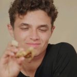 Lando Norris tortures himself with red hot wings while answering questions in Quadrant video