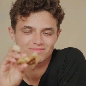Lando Norris tortures himself with red hot wings while answering questions in Quadrant video