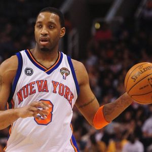 After receiving his first paycheck out of the $12 million-Adidas deal, Tracy McGrady was swimming around with $500,000 on his bed.