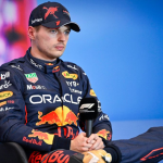 Max Verstappen Signs His Branded Onesie for F1 Expert