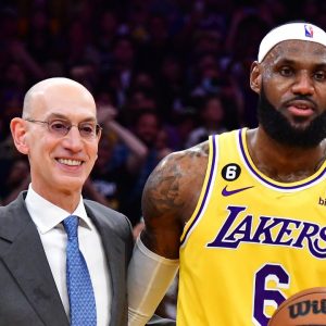 Los Angeles Lakers forward LeBron James (6) poses for a photo after becoming the NBA all time scoring leader withformer player Kareem Abdul-Jabbar and commissioner Adam Silver during the second half at Crypto.com Arena.