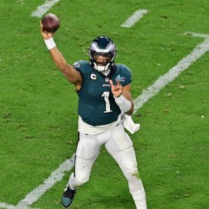 Why was Jalen Hurts benched in college?