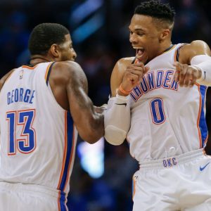 Russell Westbrook and Paul George celebrate a made basket, going into a timeout. Credits: USA Today Sports