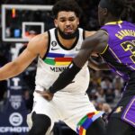 Mar 31, 2023; Minneapolis, Minnesota, USA; Minnesota Timberwolves center Karl-Anthony Towns (32) dribbles while Los Angeles Lakers forward Wenyen Gabriel (35) defends during the third quarter at Target Center. Mandatory Credit: Matt Krohn-USA TODAY Sports