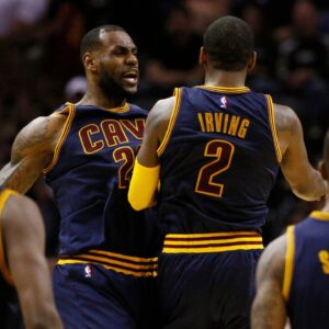 Kyrie Irving (2) and LeBron James (23) celebrate a Cavaliers lead before a timeout