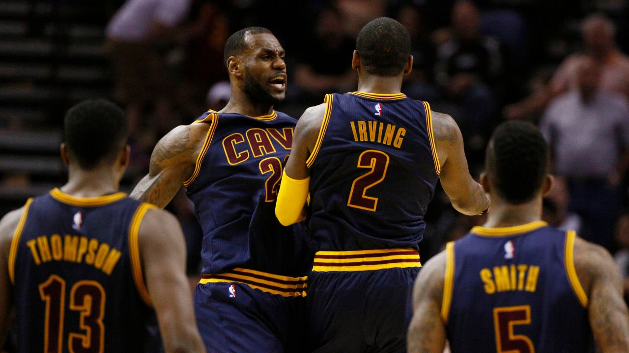 Kyrie Irving (2) and LeBron James (23) celebrate a Cavaliers lead before a timeout