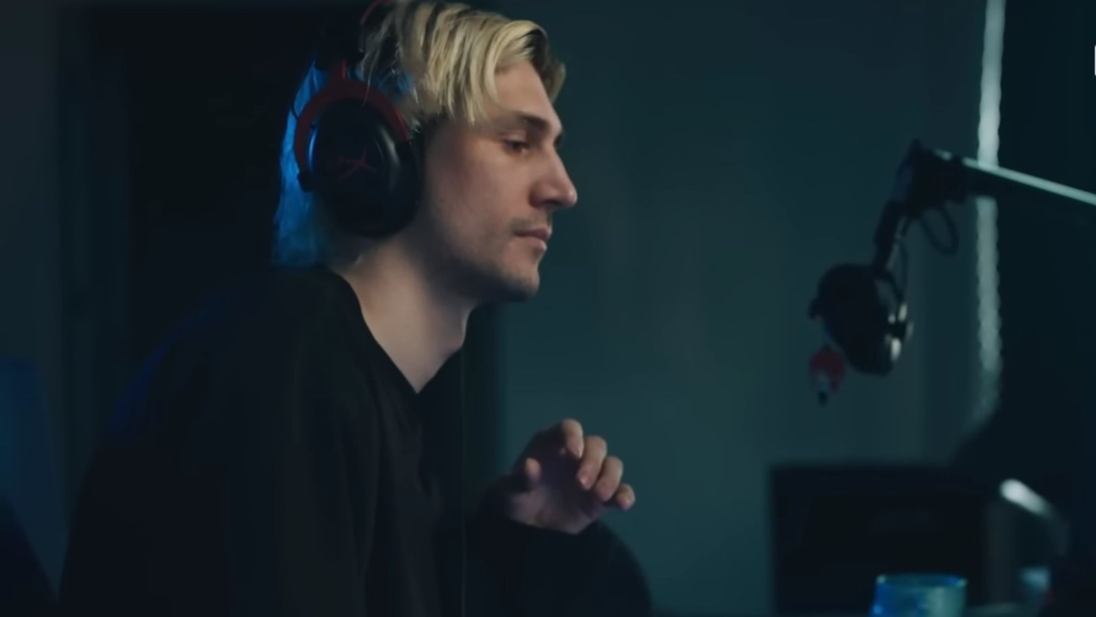 An image featuring the side-face of xQc