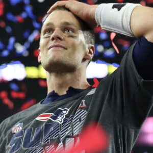 New England Patriots quarterback Tom Brady (12) celebrates with the Vince Lombardi Trophy after beating the Atlanta Falcons during Super Bowl LI at NRG Stadium.
