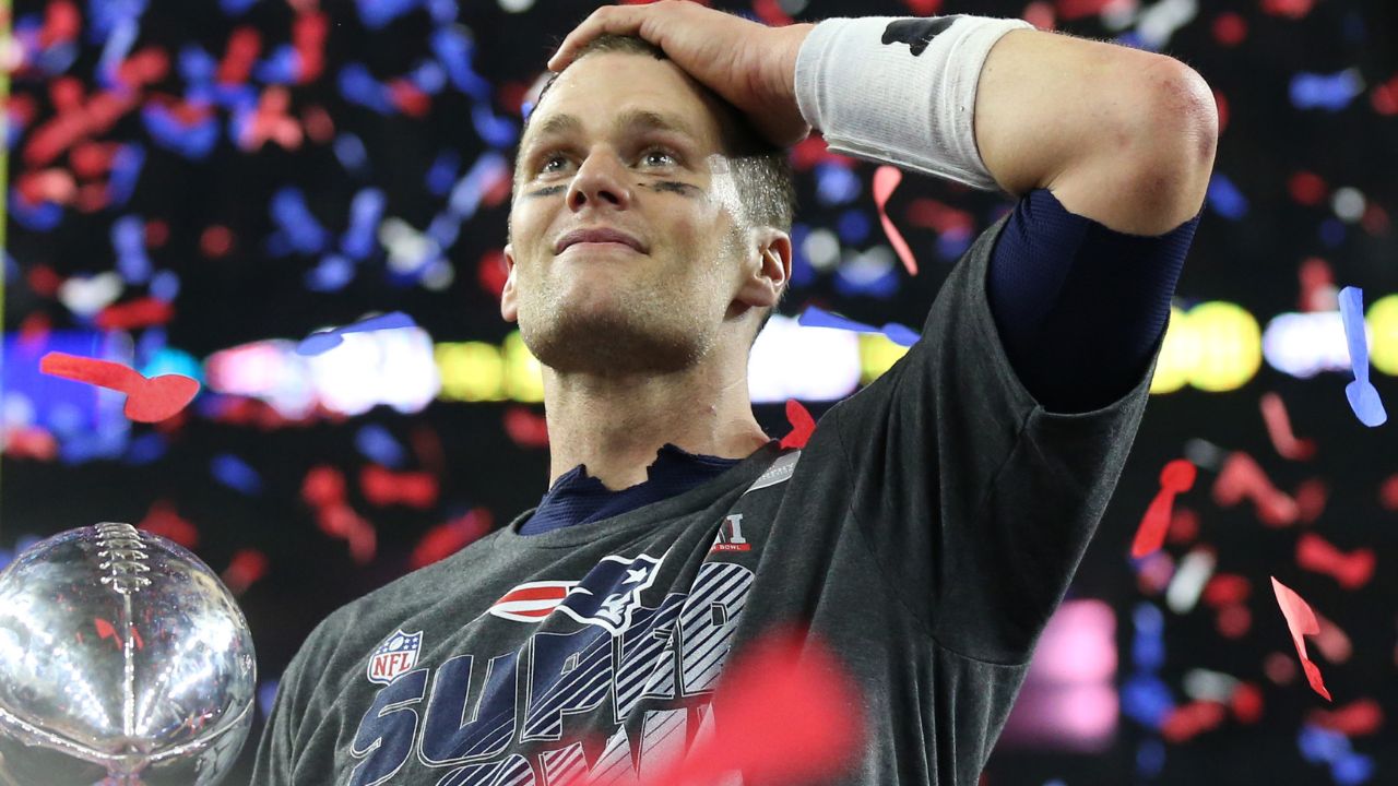 New England Patriots quarterback Tom Brady (12) celebrates with the Vince Lombardi Trophy after beating the Atlanta Falcons during Super Bowl LI at NRG Stadium.