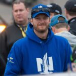 Sprint Cup Series driver Dale Earnhardt Jr. (88) waits out a rain delayed start of the Duck Commander 500 at Texas Motor Speedway.