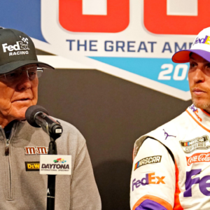 Feb 17, 2020; Daytona Beach, Florida, USA; NASCAR Cup Series driver Denny Hamlin (11) speaks to media with team owner Joe Gibbs (left) after the Daytona 500 at Daytona International Speedway. Mandatory Credit: John David Mercer-USA TODAY Sports