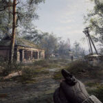 The player character holding a pistol in Stalker 2: Heart of Chornobyl