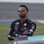Aug 25, 2023; Daytona Beach, Florida, USA; NASCAR Cup Series driver Bubba Wallace (23) on the grid prior to the Coke Zero Sugar 400 at Daytona International Speedway. Mandatory Credit: David Yeazell-USA TODAY Sports