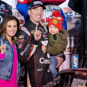Mar 2, 2018; Las Vegas, NV, USA; Camping World Truck Series driver Kyle Busch (51) and son Brexton Busch and wife Samantha Busch celebrate Kyle winning the Stratosphere 200 at Las Vegas Motor Speedway. Mandatory Credit: Jerome Miron-USA TODAY Sports