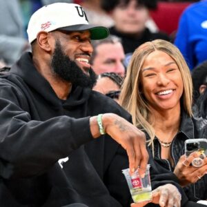 Mar 28, 2023; Houston, TX, USA; Los Angeles Laker LeBron James and his wife Savannah James sit court side at the McDonald's All American game during the first half at Toyota Center. Mandatory Credit: Maria Lysaker-USA TODAY Sports