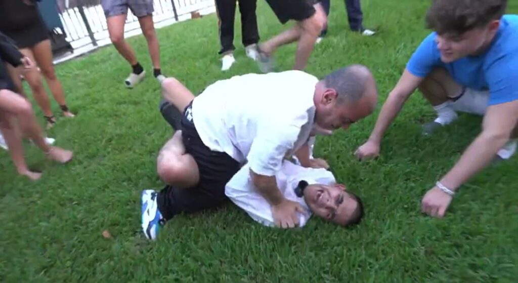 N3on wrestles a dwarf and is taken down with ease